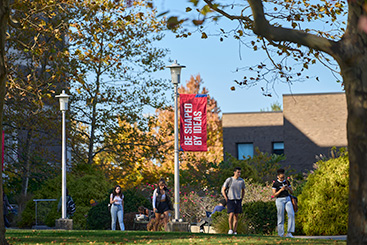 Students walking outside on campus. Links to Beneficiary Designations