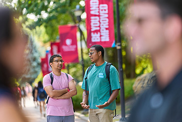 Students having a conversation. Links to Gifts of Appreciated Securities