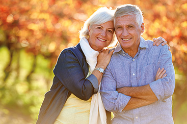 A couple smiling for the camera. Links to Over Age 70